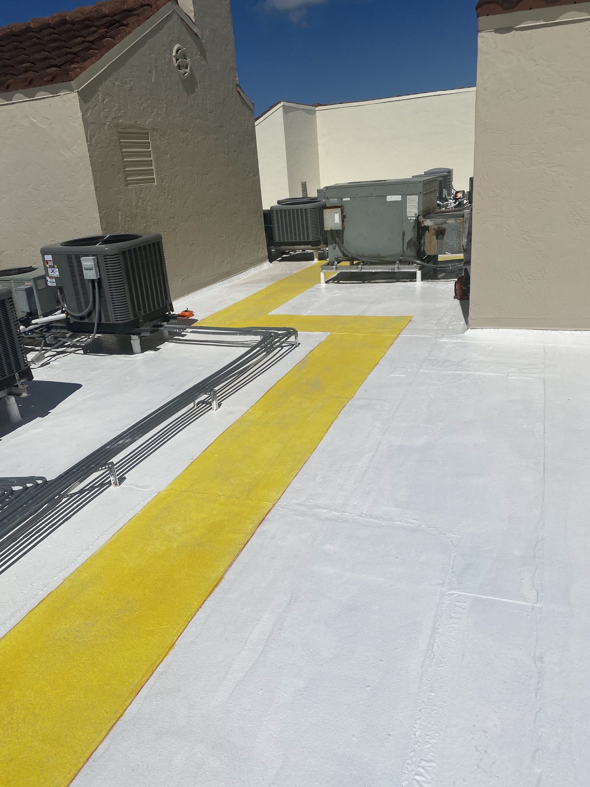 Walkway deck coating with safety striping