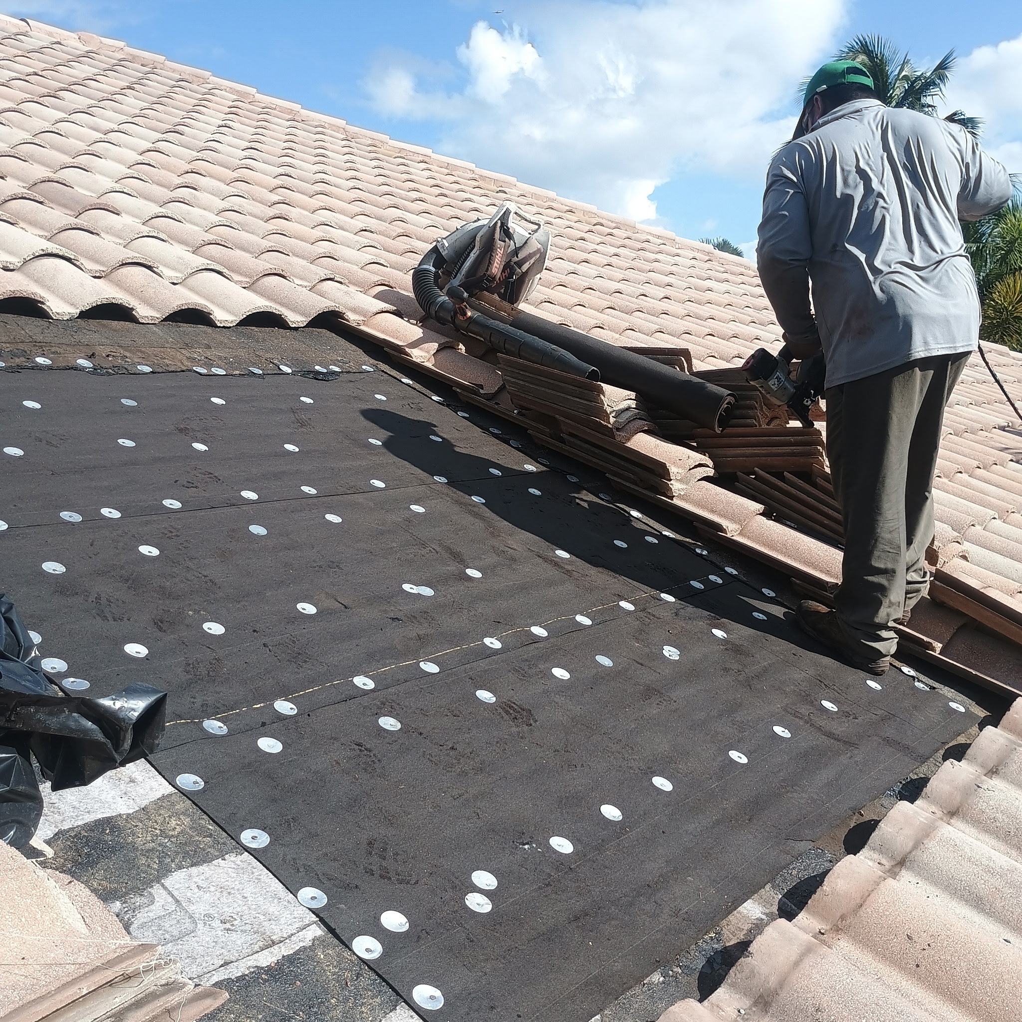 Tile roof tear-off down to new underlayment
