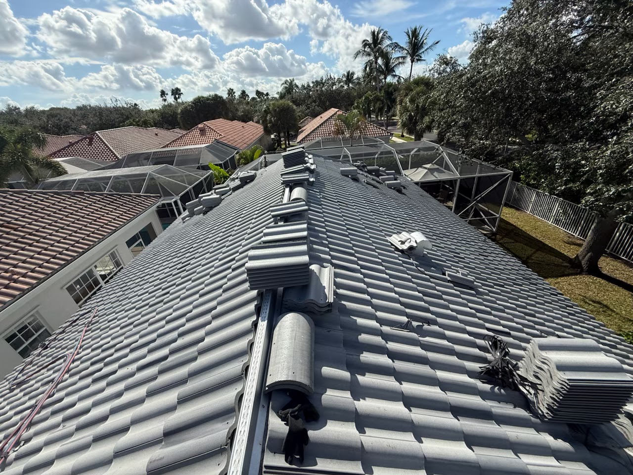 Gray flat concrete tile roof installed by A-1