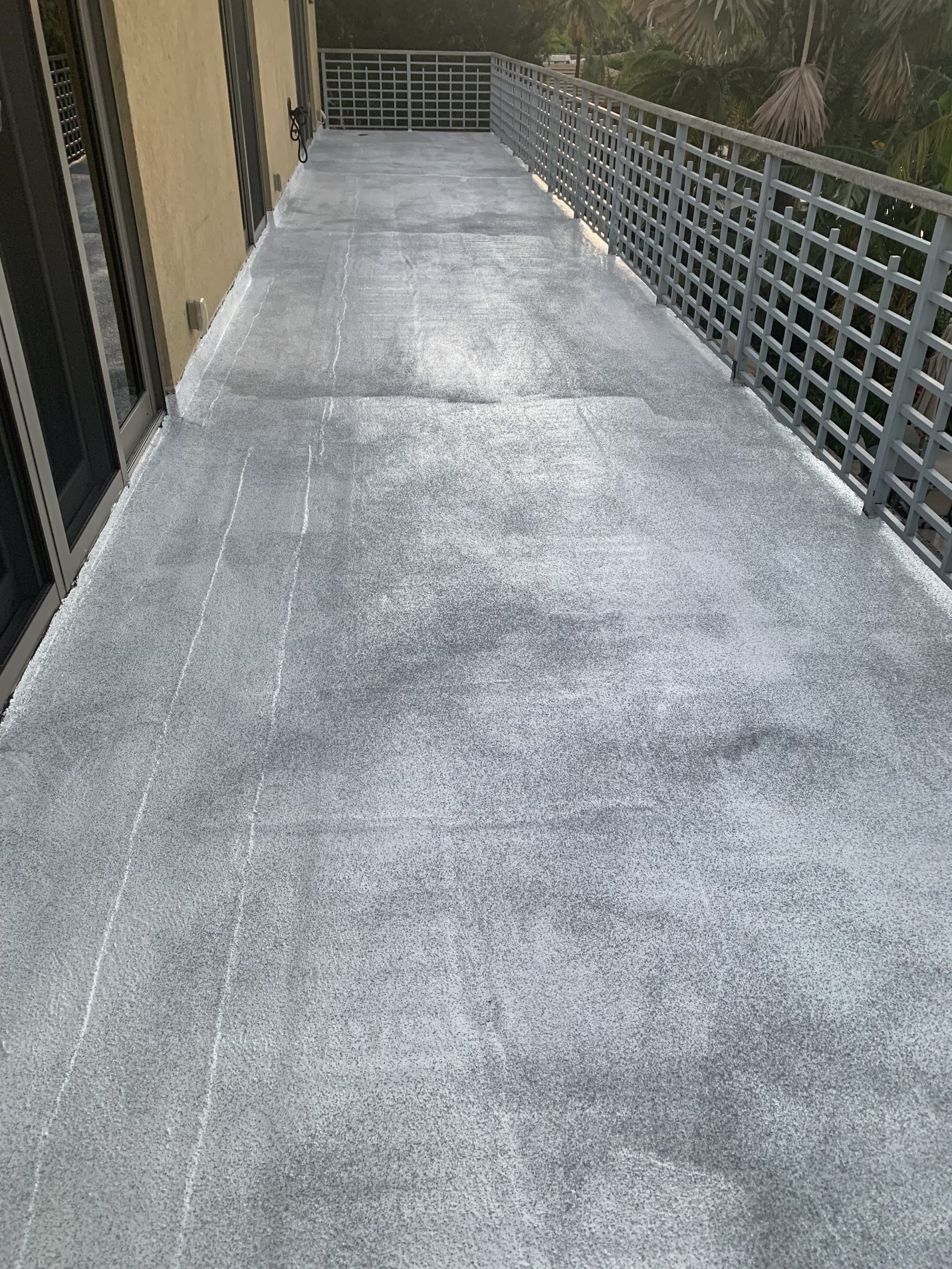 Coated concrete walkway after waterproofing