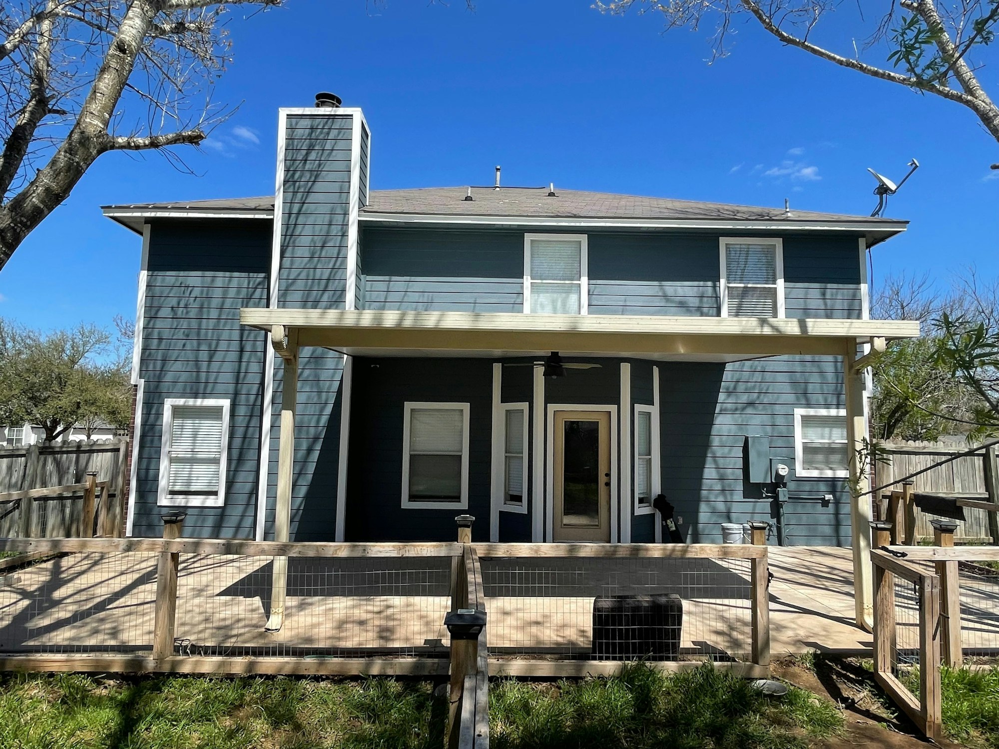 Two-story home with blue lap siding